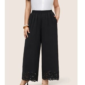 BloomChic size 28 wide leg laser cutout on legs. Black. NWT. Elastic waist